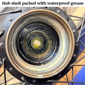 Hub shell packed with waterproof grease